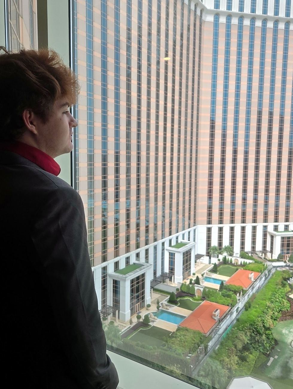 Looking out over a resort courtyard from a high-rise window in Macau